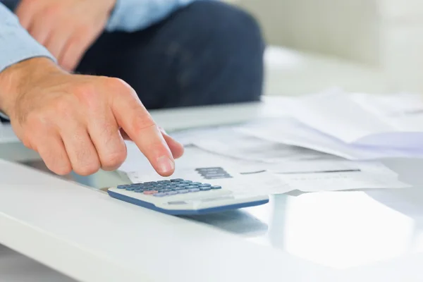 Close up of hand using calculator — Stock Photo, Image