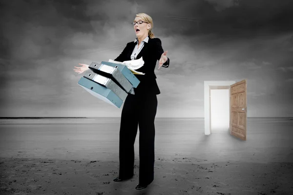 Shocked businesswoman dropping folders — Stock Photo, Image