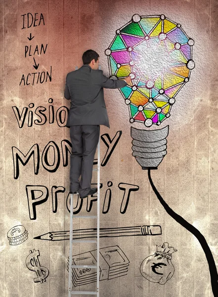 電球茶色の壁に描かれた実業家に触れるの背面図 — ストック写真