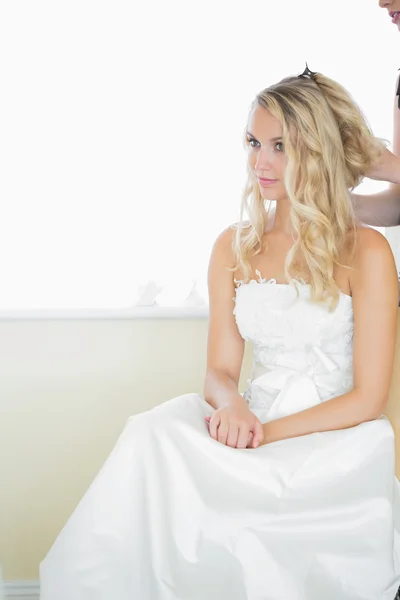 Beautiful blonde bride being prepared for the wedding — Stock Photo, Image