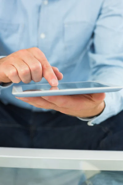 Close up of man holding and using tablet — Stock Photo, Image