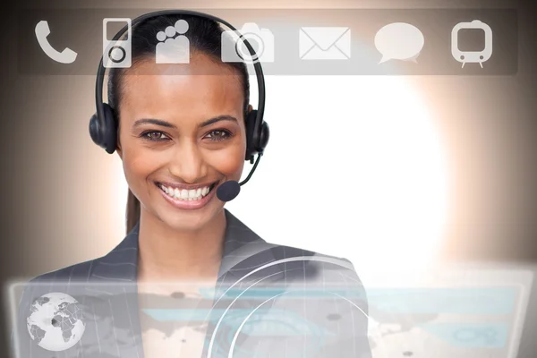 Beautiful smiling businesswoman using futuristic interface showing applications — Stock Photo, Image