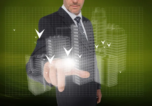 Businessman pointing at holographic faint city — Stock Photo, Image