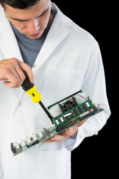 Attractive serious computer engineer repairing hardware — Stock Photo, Image