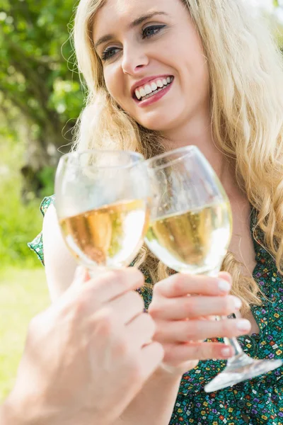 Blonde young woman toasting with her boyfriend — Stock Photo, Image