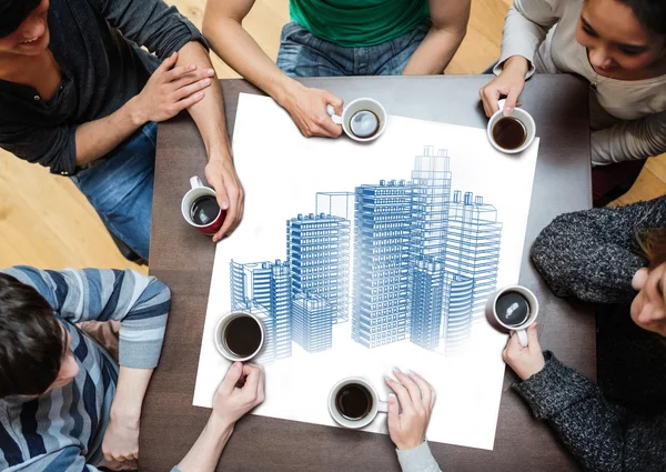 Overhead view of people sitting around table — Stock Photo, Image