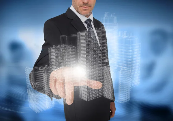 Businessman touching holographic faint city — Stock Photo, Image