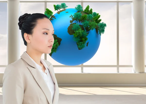 Composite image of unsmiling asian businesswoman — Stock Photo, Image