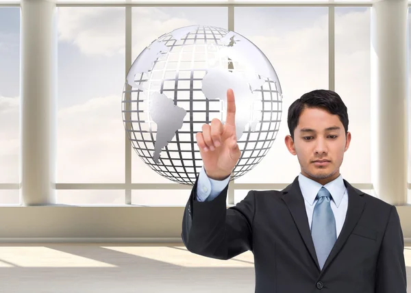 Composite image of serious asian businessman pointing — Stock Photo, Image