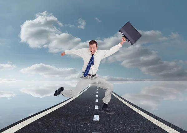 Cheerful jumping businessman with his suitcase — Stock Photo, Image