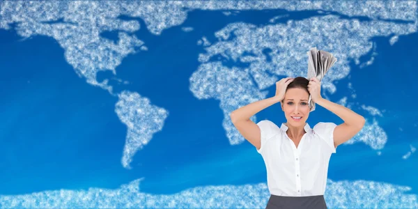 Worried stylish businesswoman holding newspaper — Stock Photo, Image