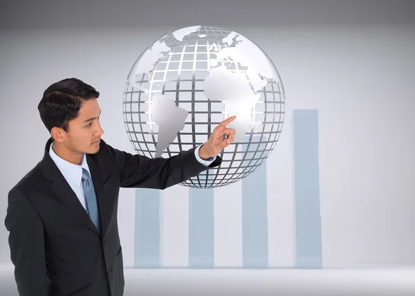 Composite image of stern asian businessman pointing — Stock Photo, Image