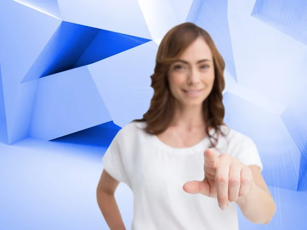 Attractive businesswoman looking and pointing at camera — Stock Photo, Image