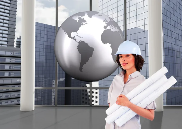 Confident woman holding construction plans — Stock Photo, Image