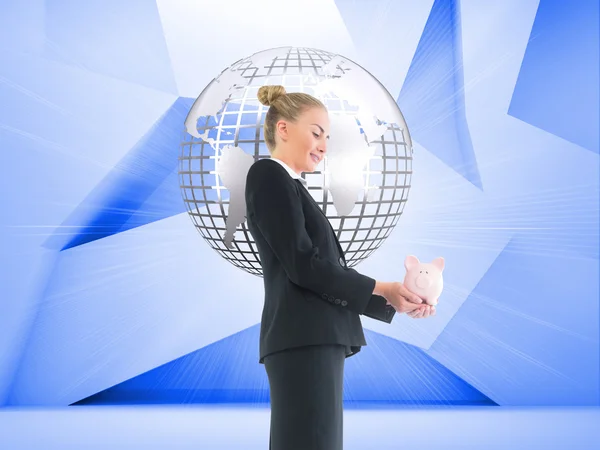 Composite image of businesswoman holding pink piggy bank — Stock Photo, Image