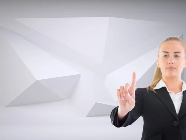 Blonde businesswoman pointing somewhere — Stock Photo, Image