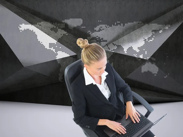 Businesswoman sitting on swivel chair with laptop — Stock Photo, Image