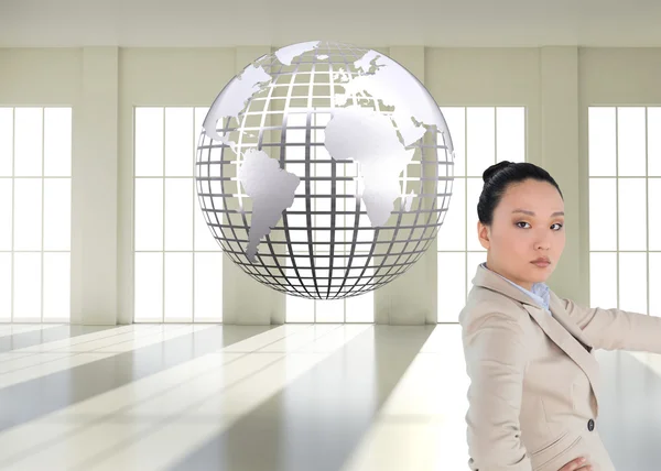Immagine composita di donna d'affari asiatica non sorridente che indica — Foto Stock