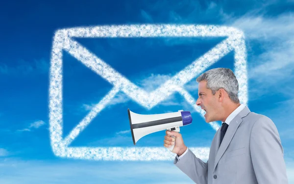 Businessman shouting in loudspeaker — Stock Photo, Image