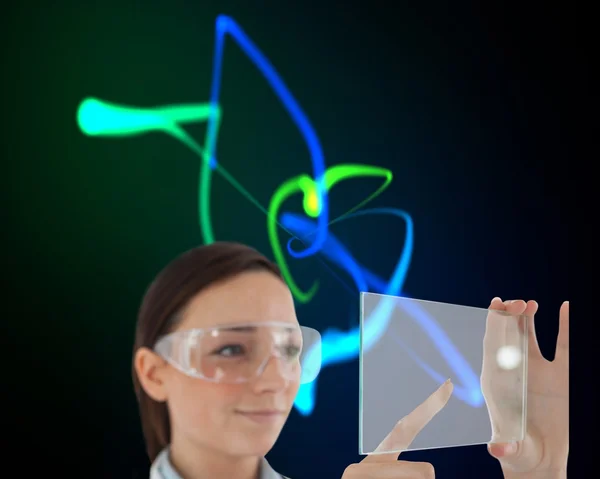 Doctor in protective glasses holding virtual screen — Stock Photo, Image