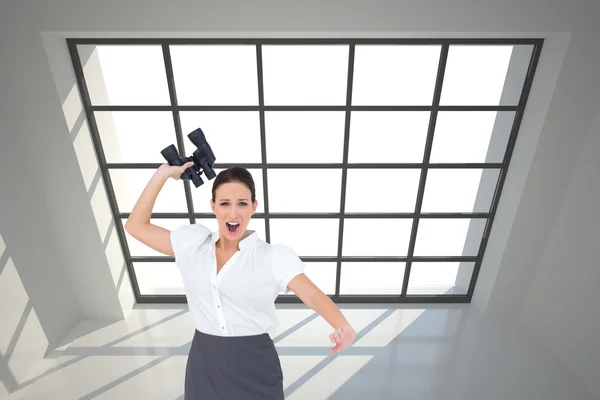 Businesswoman throwing binoculars away — Stock Photo, Image