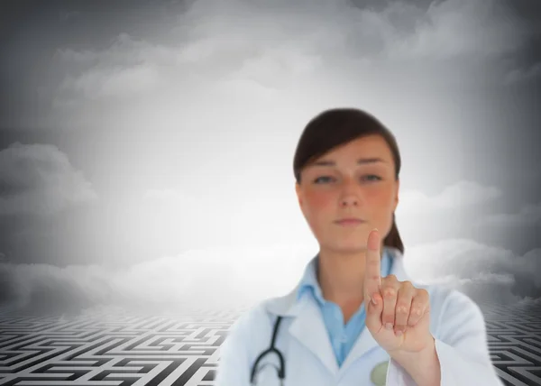 Young brunette doctor pointing — Stock Photo, Image