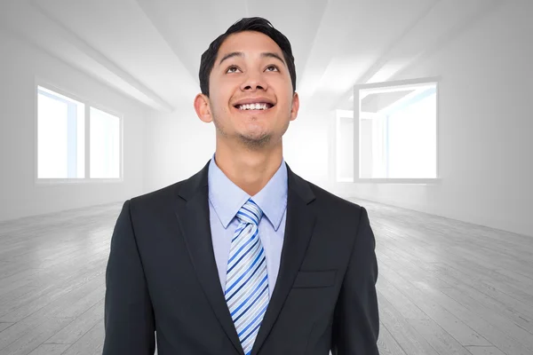 Compuesto imagen de sonriente asiático empresario — Foto de Stock