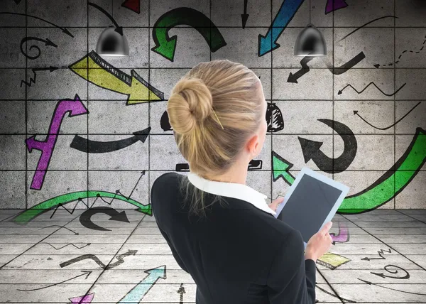 Blonde businesswoman holding new tablet — Stock Photo, Image