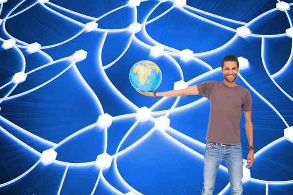 Hombre guapo sosteniendo un globo — Foto de Stock