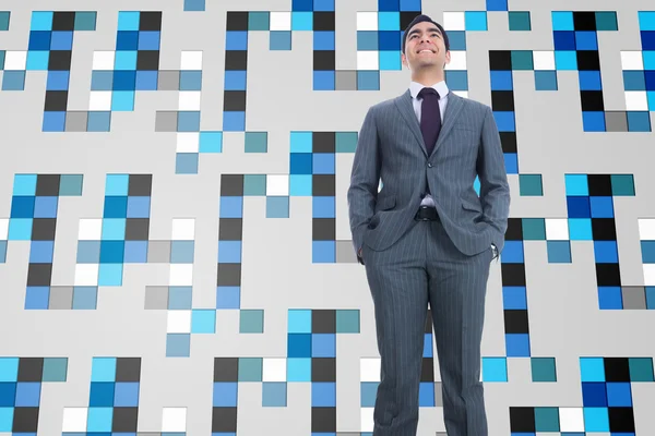 Composite image of smiling businessman standing — Stock Photo, Image