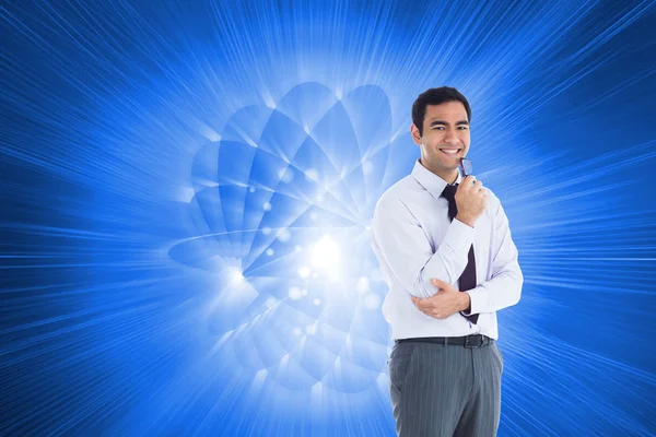 Composite image of smiling businessman holding glasses — Stock Photo, Image