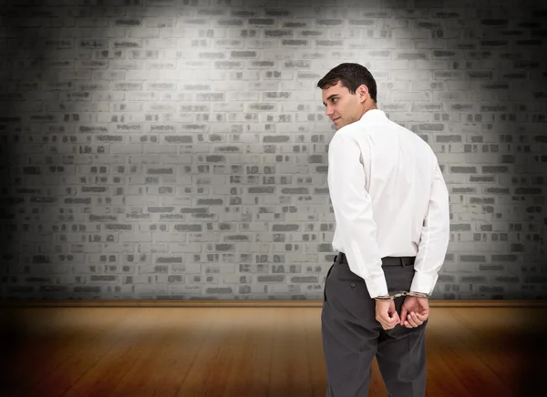 Serious businessman wearing handcuffs — Stock Photo, Image