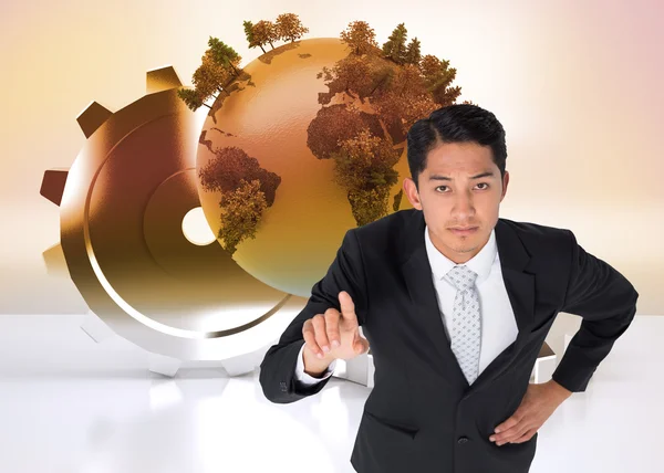 Composite image of unsmiling asian businessman pointing — Stock Photo, Image