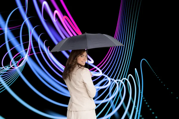 Classy businesswoman holding umbrella — Stock Photo, Image