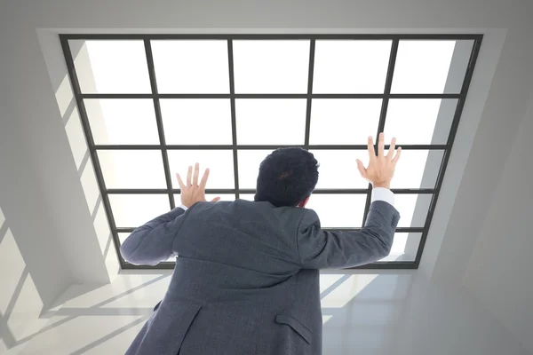 Composite image of businessman with arms raised — Stock Photo, Image