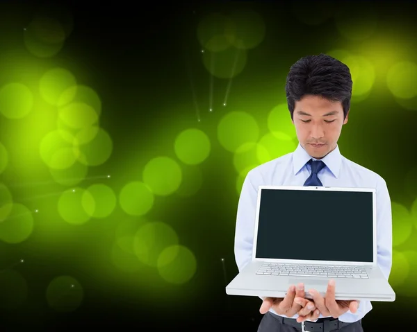 Businessman showing a laptop — Stock Photo, Image