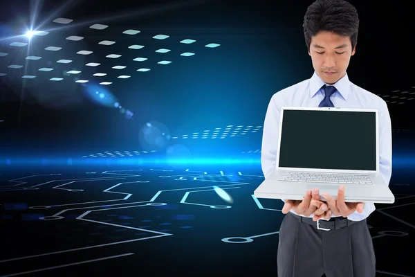 Composite image of businessman showing a laptop — Stock Photo, Image