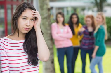 Student being bullied by a group of students clipart