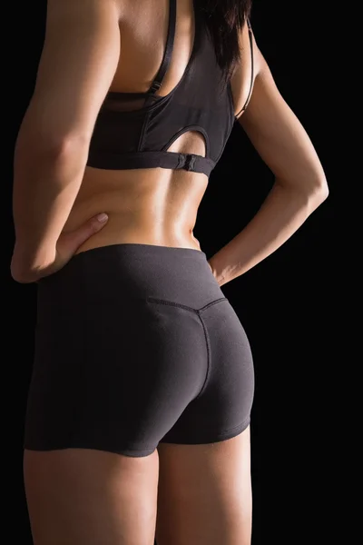 In mezzo alla parte posteriore della giovane donna magra che indossa sportswe — Foto Stock