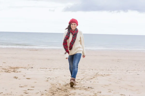 Pretty woman in stylish warm wear at beach — Stock Photo, Image