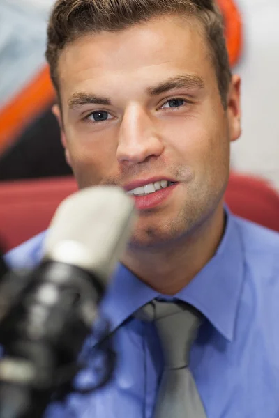 Well dressed smiling radio host moderating — Stock Photo, Image