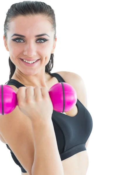 Vrolijke aantrekkelijke vrouw training met een stom-bell — Stockfoto