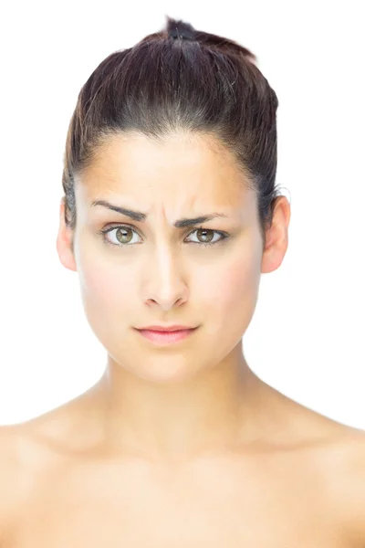 Front view of sceptical woman looking at camera — Stock Photo, Image
