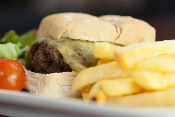 Close up of burger with french fries — Stock Photo, Image