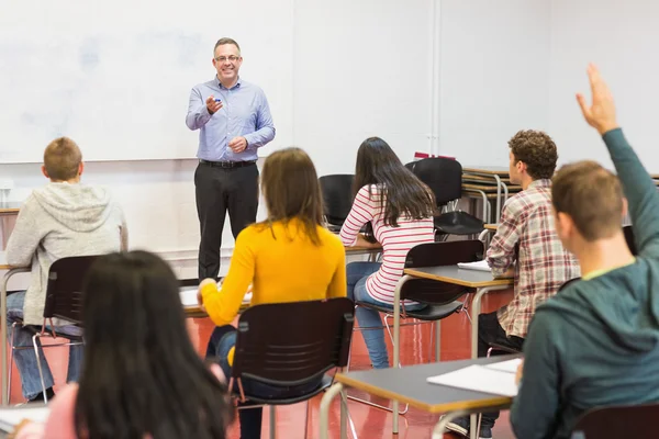 Attentive students and teacher in the classroom — Stock Photo, Image