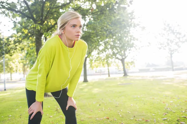 Active exhausted blonde catching her breath — Stock Photo, Image