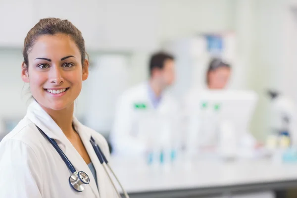 Close-up portrait of confident doctor at medical office — Stock Photo, Image