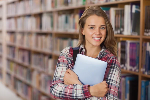 Pretty cheerful student holding tablet — Stock Photo, Image