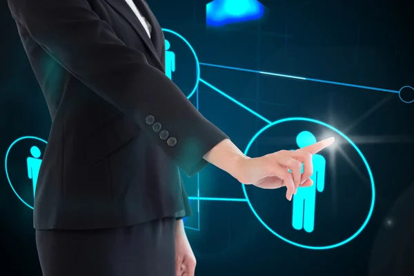 Composite image of businesswoman pointing on glowing futuristic — Stock Photo, Image