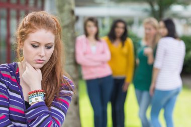 Student being bullied by a group of students clipart